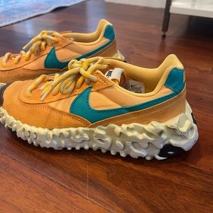 New and never worn Nike Overbreak in color combo “Pollen Rise.” Size 9.